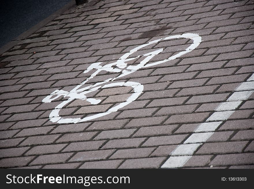 Bike parking sign on the road