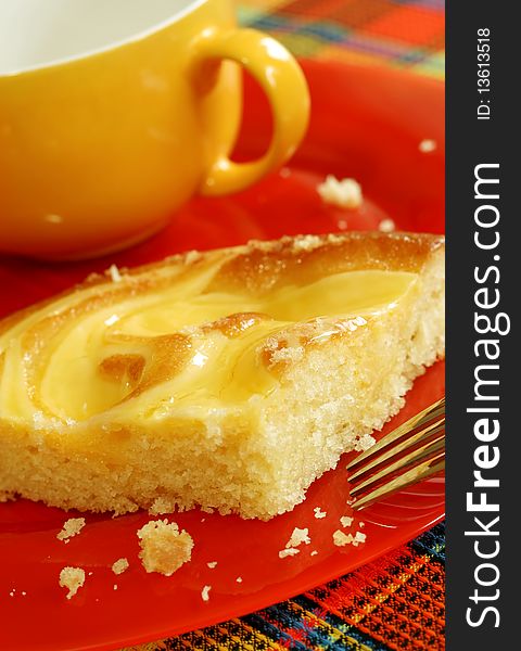 cake and cup on red plate