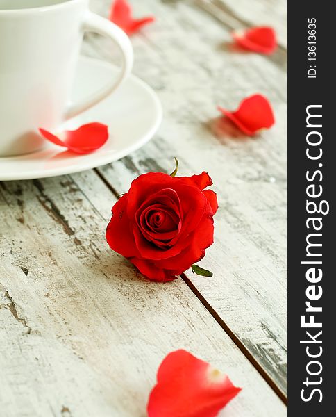 Red Rose And Cup On Old Wooden