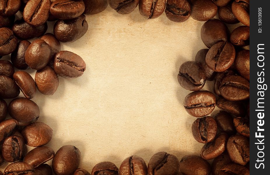 Coffee beans on a vintage texture. Coffee beans on a vintage texture