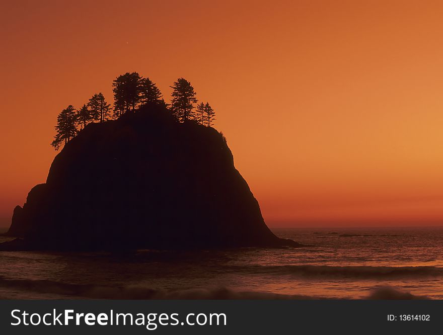 Silhouette of a sea stack on the Washington Coast, evening, suneset. Silhouette of a sea stack on the Washington Coast, evening, suneset