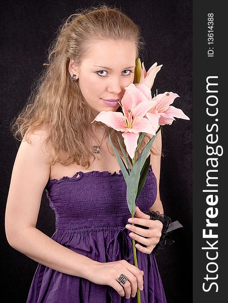 Portrait of a young girl with a lily flower. Portrait of a young girl with a lily flower