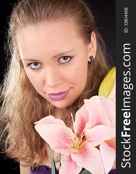 Portrait of a young girl with a lily flower. Portrait of a young girl with a lily flower