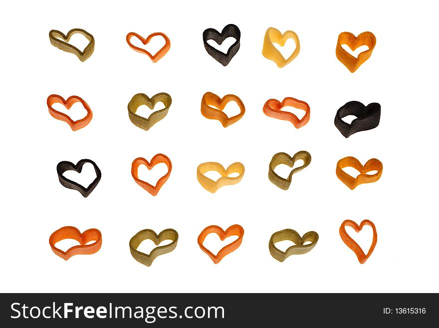 Italian colourful heart shaped pasta isolated over white background. Italian colourful heart shaped pasta isolated over white background.