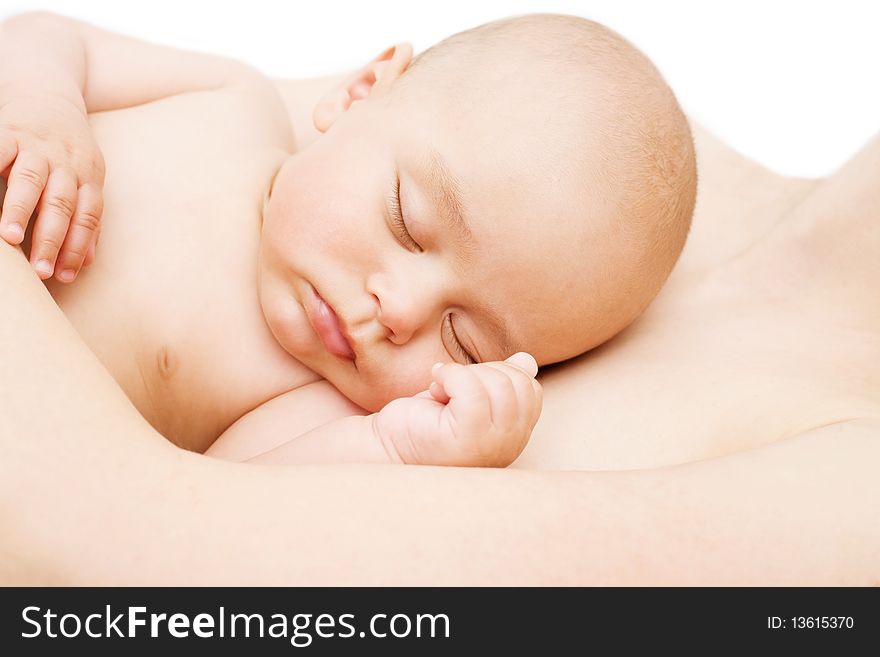 Sleeping baby on breast of his mother