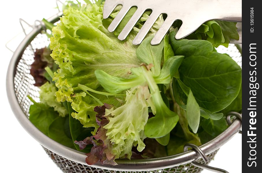 Green salad, different kinds of garden salad in a sieve