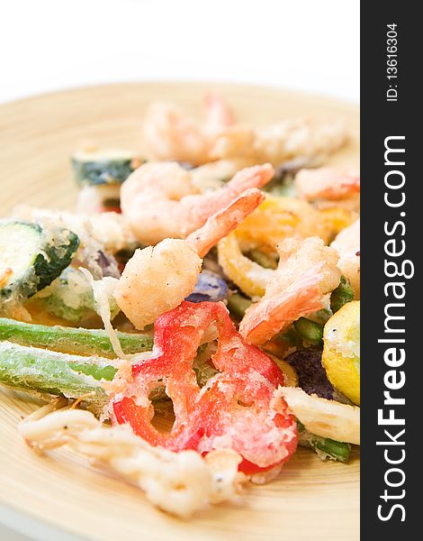 Shrimp and a variety of tempura fried vegetables including potato, string bean, asparagus, and peppers. Shrimp and a variety of tempura fried vegetables including potato, string bean, asparagus, and peppers