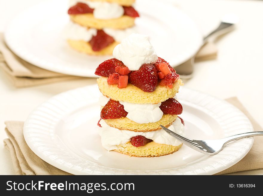 Three layer strawberry shortcake with fresh whipped cream. Three layer strawberry shortcake with fresh whipped cream