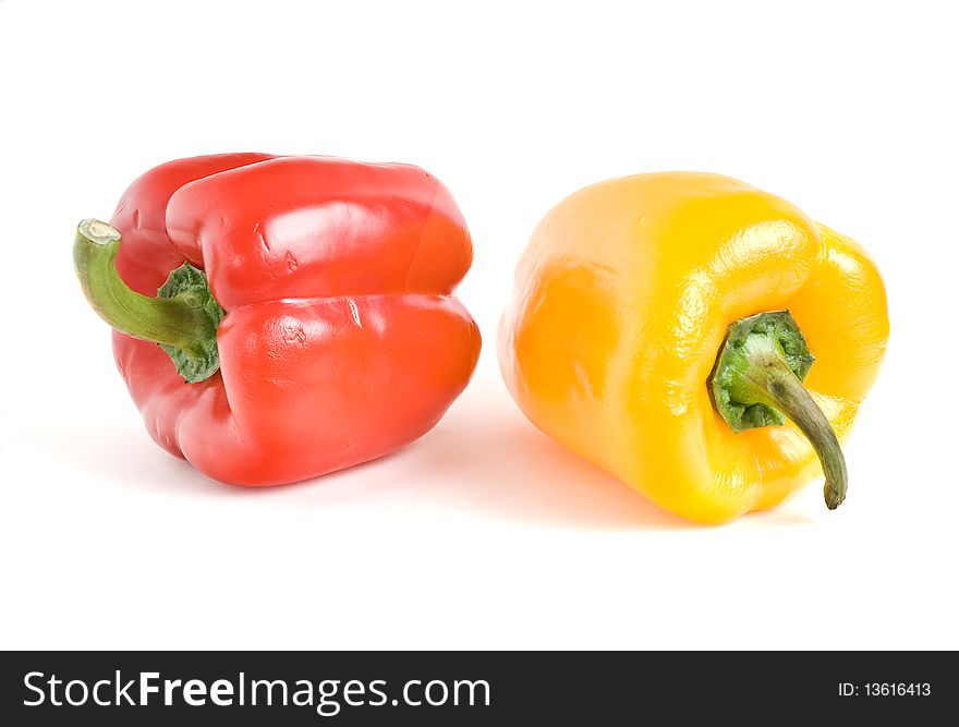 This red and yellow peppers on a white background