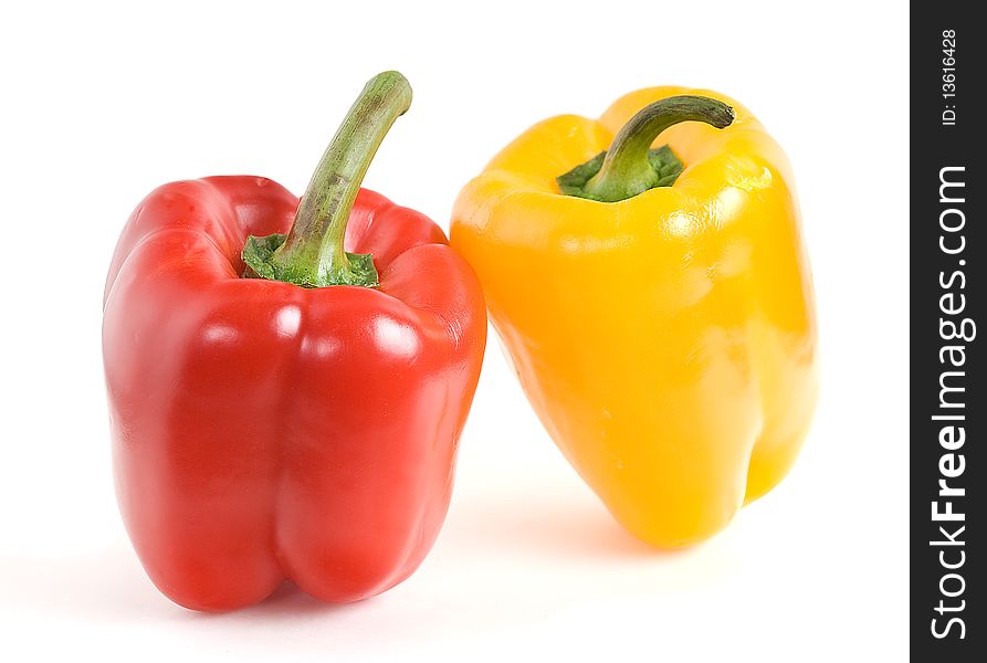 This yellow and red peppers on a white background