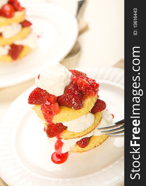 Three layer strawberry shortcake with fresh whipped cream. Three layer strawberry shortcake with fresh whipped cream