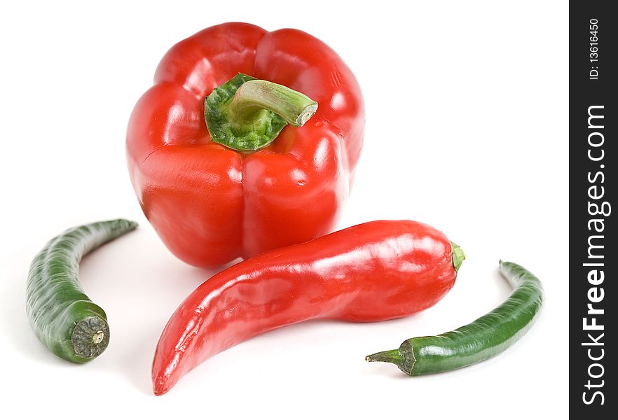 This sweet and bitter pepper on a white background. This sweet and bitter pepper on a white background