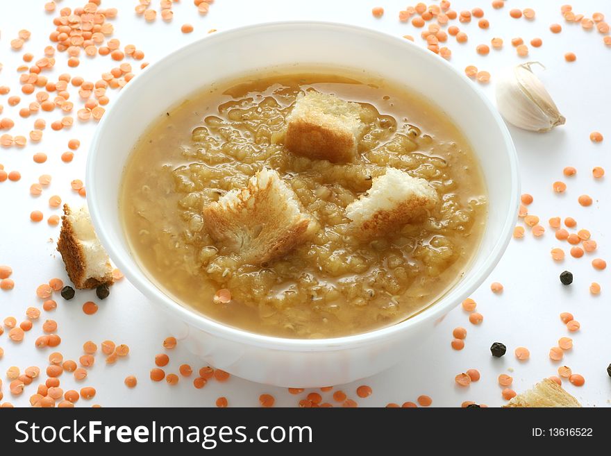 Lentil soup with toast in a bowl