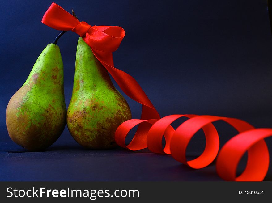 Two Pears One In A Red Gift Tape