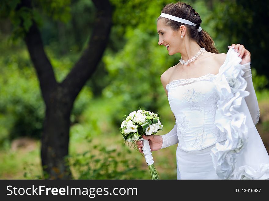 A bride near the tree