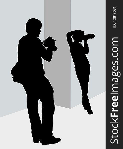 Image of young man and women photographers with equipment at work. Image of young man and women photographers with equipment at work