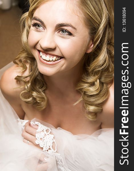 Blond bride with curly locks and beautiful features. Blond bride with curly locks and beautiful features