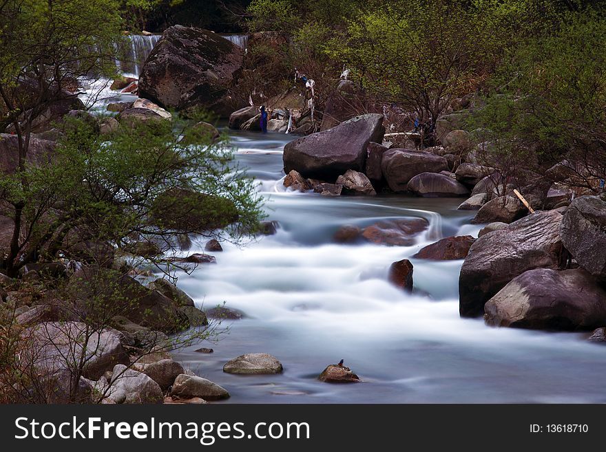 The stream of water seems like beautiful milk. The stream of water seems like beautiful milk