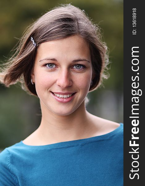 Closeup portrait of a happy young woman smiling