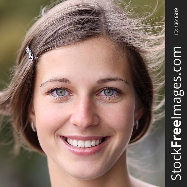 Closeup portrait of a happy young woman smiling