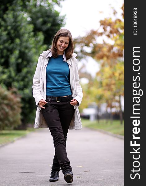 Beautiful young woman in autumn park