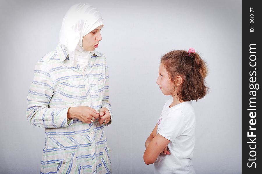 Muslim teacher with a little girl