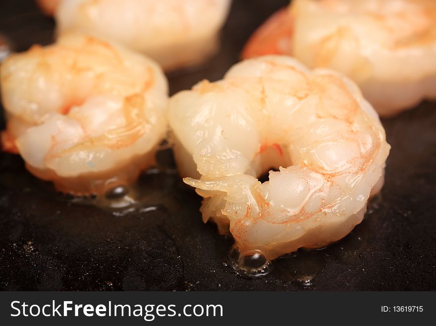 Photo of shrimp being sauteed. Photo of shrimp being sauteed.