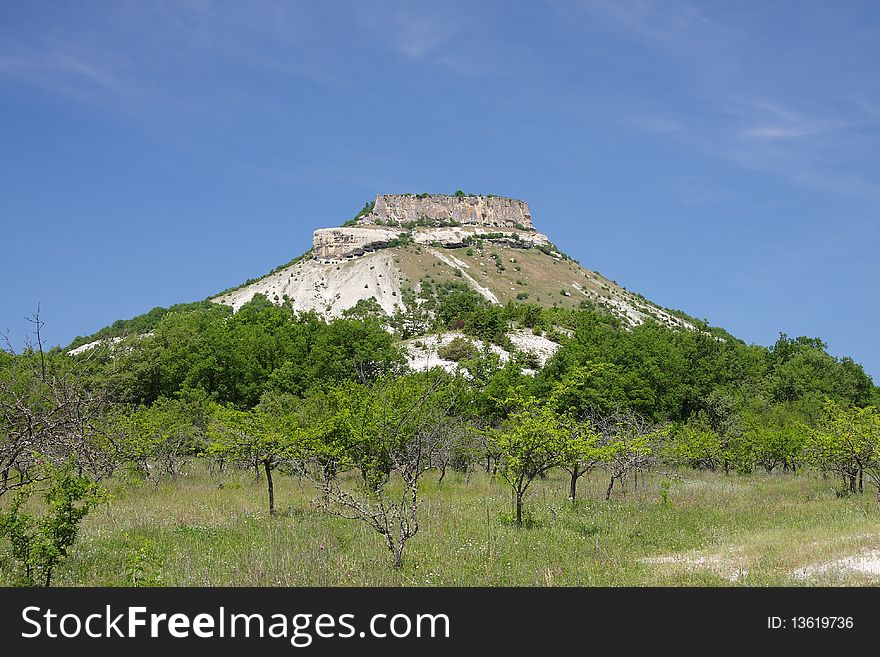 Crimea cave cathedral ''Tepe-Kermen'' under blue sky