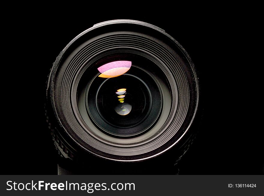 Close up view of a DSLR lens in dark atmosphere
