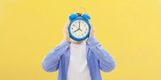 Free Young Person With Clock Or Alarm Stock Image - 136188361