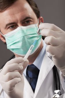 Doctor With Medical Syringe In Hands Royalty Free Stock Photography Doctor With Medical Syringe In Hands Royalty Free Stock Photography