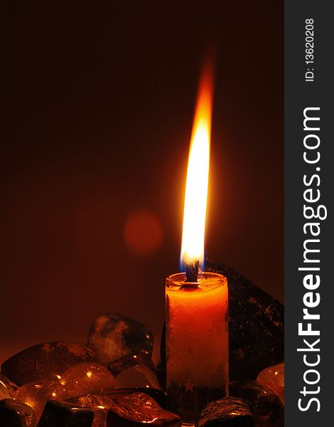 A candle on dark background.it feel alone.
