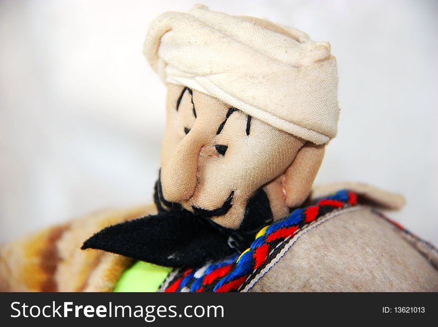 Handmade cotton doll of islamic/uyghur man with beard, bought in a market in ÃœrÃ¼mqi,Xinjiagn. Handmade cotton doll of islamic/uyghur man with beard, bought in a market in ÃœrÃ¼mqi,Xinjiagn