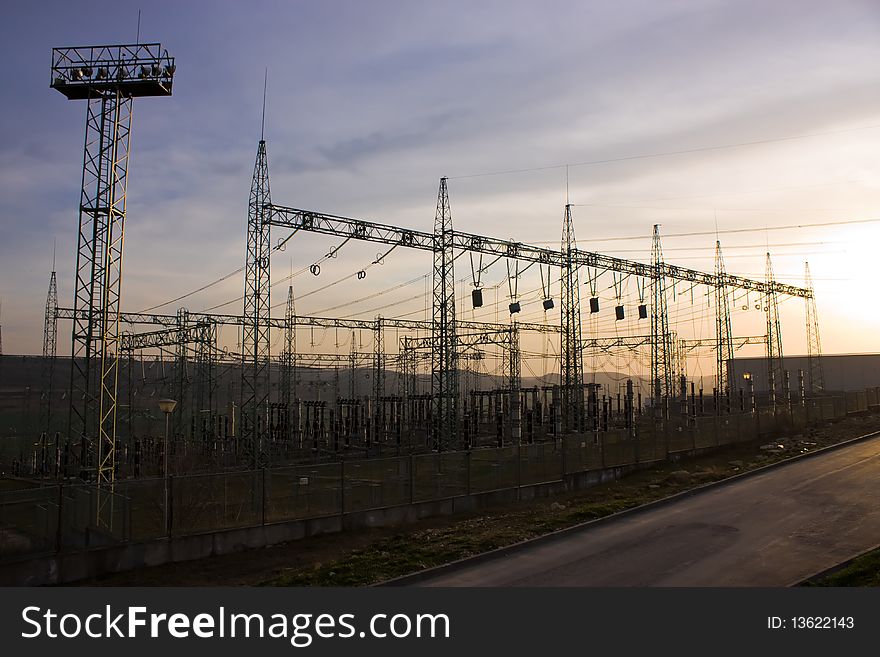 Electrical utility transformer substation on sunset. Electrical utility transformer substation on sunset