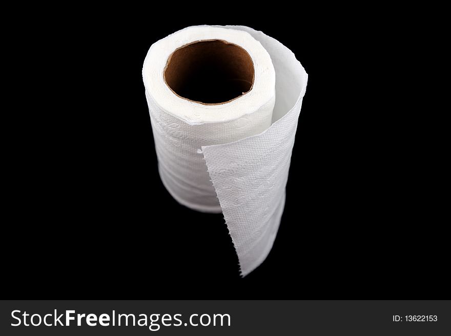 Roll of tissue paper on black