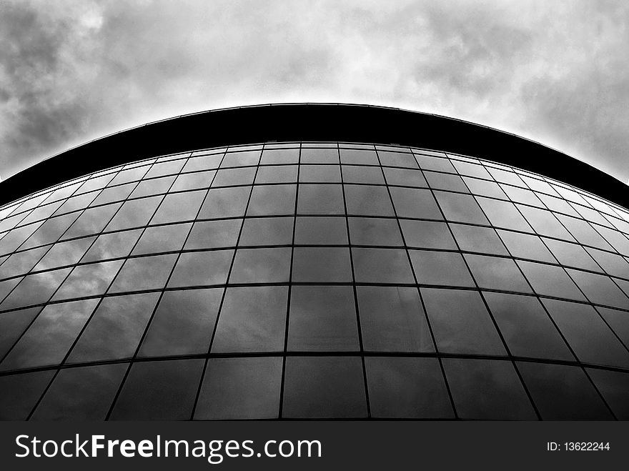 An abstract shot of a full glass panel building. An abstract shot of a full glass panel building