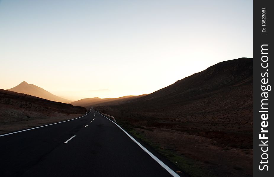 Endless road among desert mountains, Fuerteventura