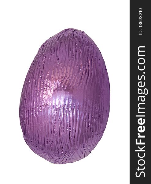 Single chocolate easter egg isolated on white wrapped in shiny purple foil. Single chocolate easter egg isolated on white wrapped in shiny purple foil