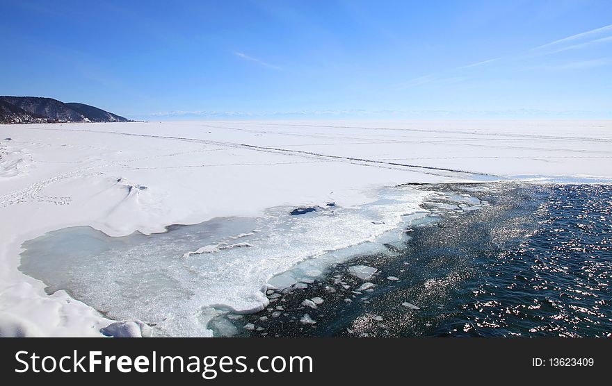 Frozen Lake Baikal. Spring. Day.