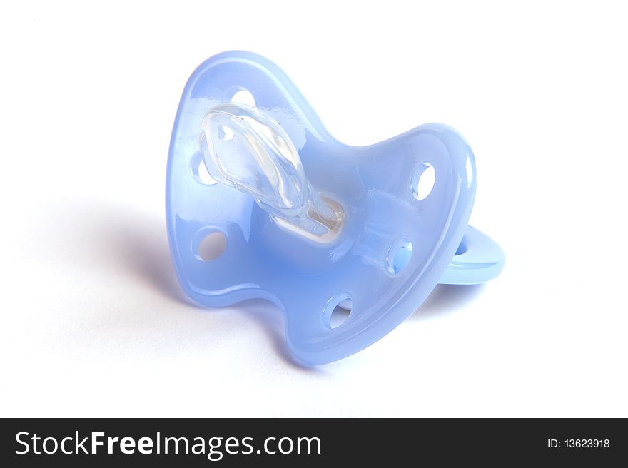 A light blue pacifier for babies on a white background. A light blue pacifier for babies on a white background