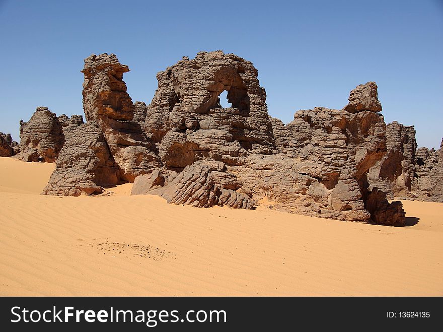 Sandstone peaks in the desert of Libya, in Africa. Sandstone peaks in the desert of Libya, in Africa