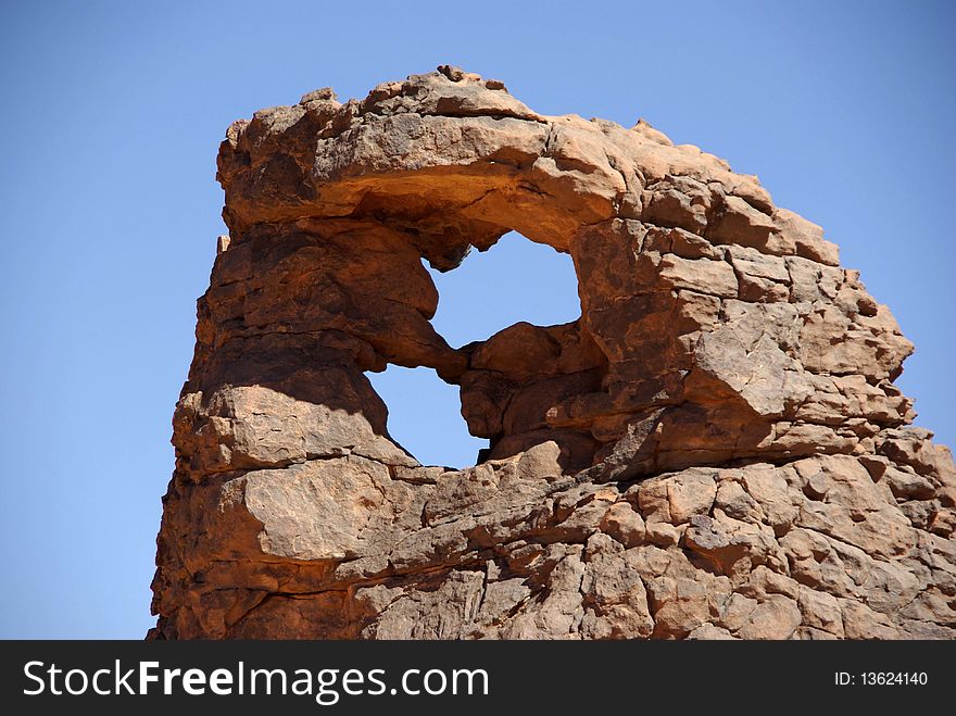 A rock in the desert of Libya, in Africa. A rock in the desert of Libya, in Africa