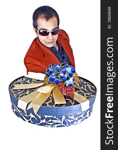 A young man is giving an ornamental giftbox. A young man is giving an ornamental giftbox