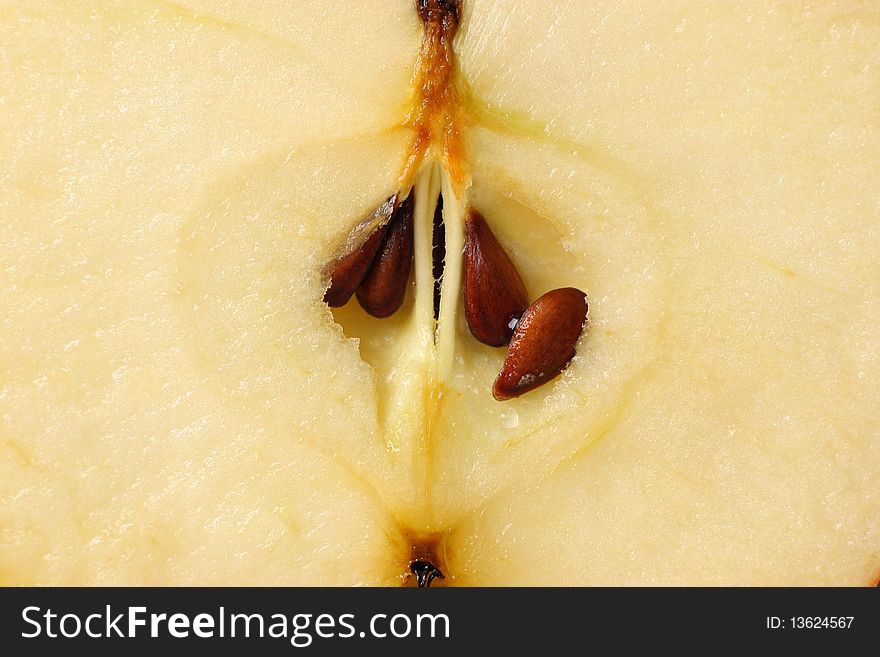 Closeup of an juicy fresh apple inside showing seeds and core. Closeup of an juicy fresh apple inside showing seeds and core.