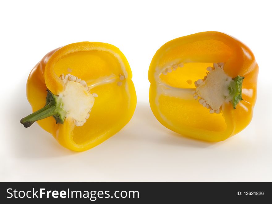 Close up of yellow paprika cut in half. Isolated on white with clipping path