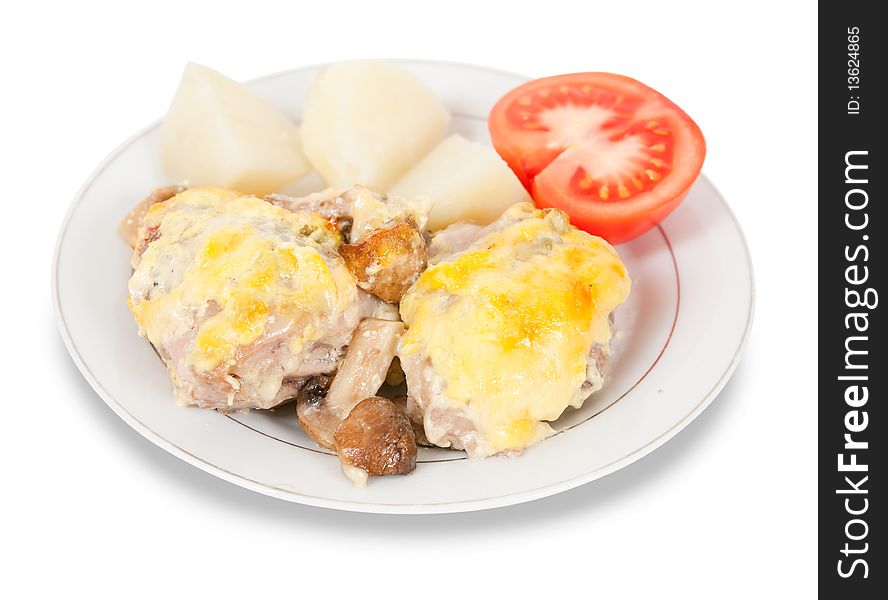 Stewed chicken with mushrooms and cheese on plate. Stewed chicken with mushrooms and cheese on plate