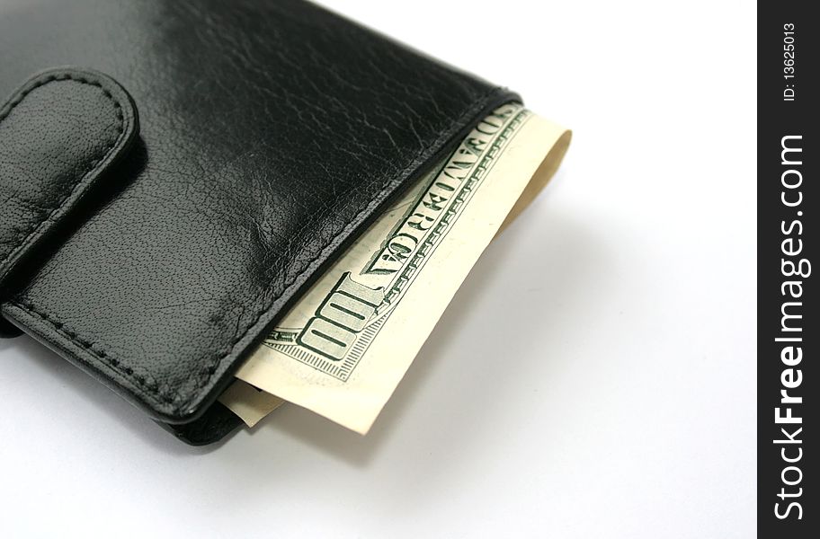 One hundred dollars banknote in a black purse. One hundred dollars banknote in a black purse