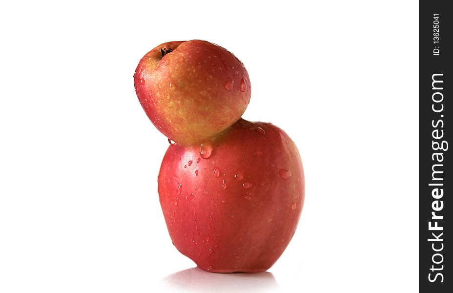 Two connected apples on the white background. Two connected apples on the white background