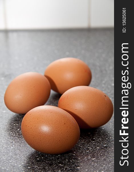 Fresh brown eggs standing in the kitchen