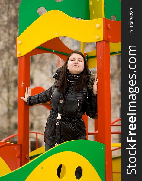 Beautiful cute girl on ladder in playground. Outdoor park. Beautiful cute girl on ladder in playground. Outdoor park.